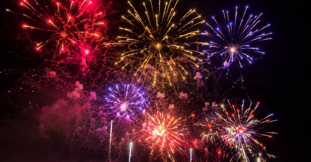 Colorful fireworks bursting over Oklahoma City skyline with patriotic red, white, and blue effects